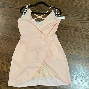 Peach Lacy Mini dress. Lightweight mock wrap front. Zipper back